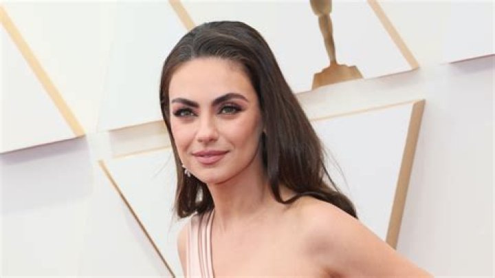 Why does Mila Kunis have different colored eyes?